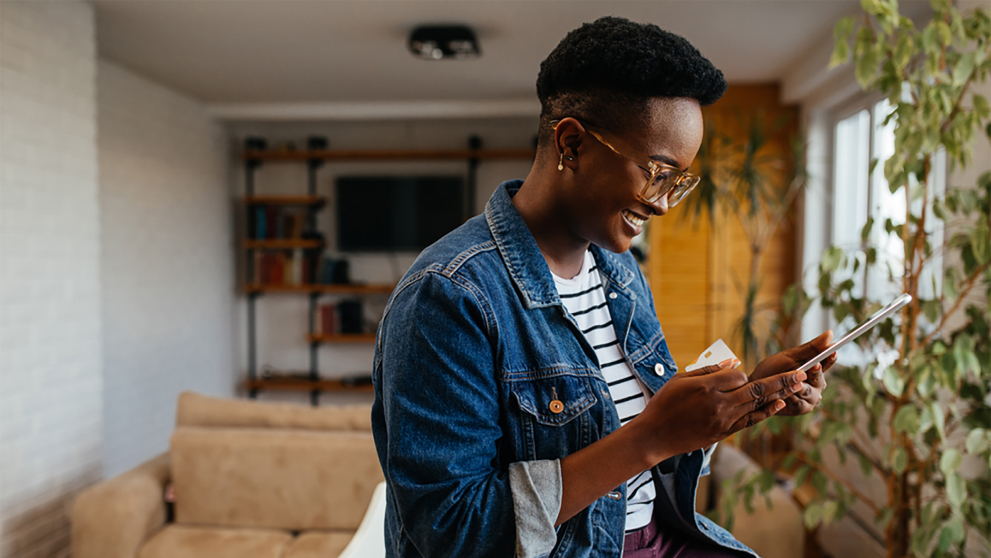 Nigerian business owner using top business tools on mobile phone